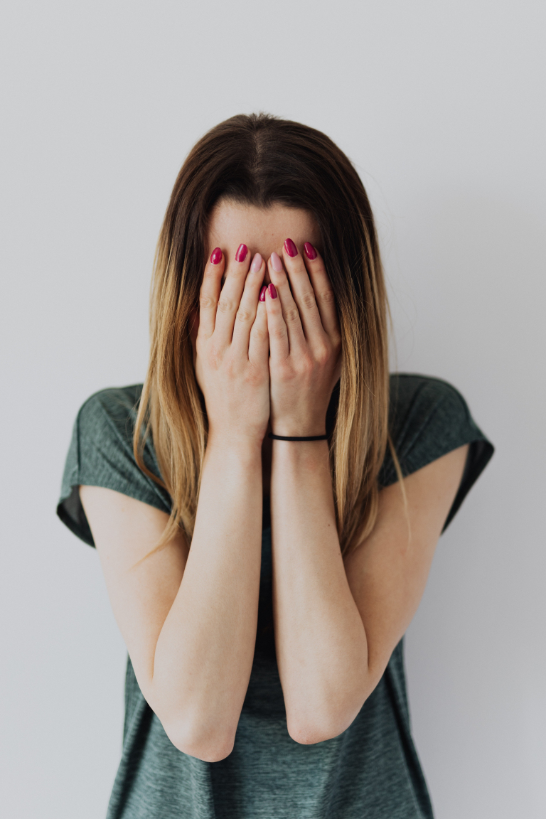 Woman sitting quietly at home before an online abuse counselling session