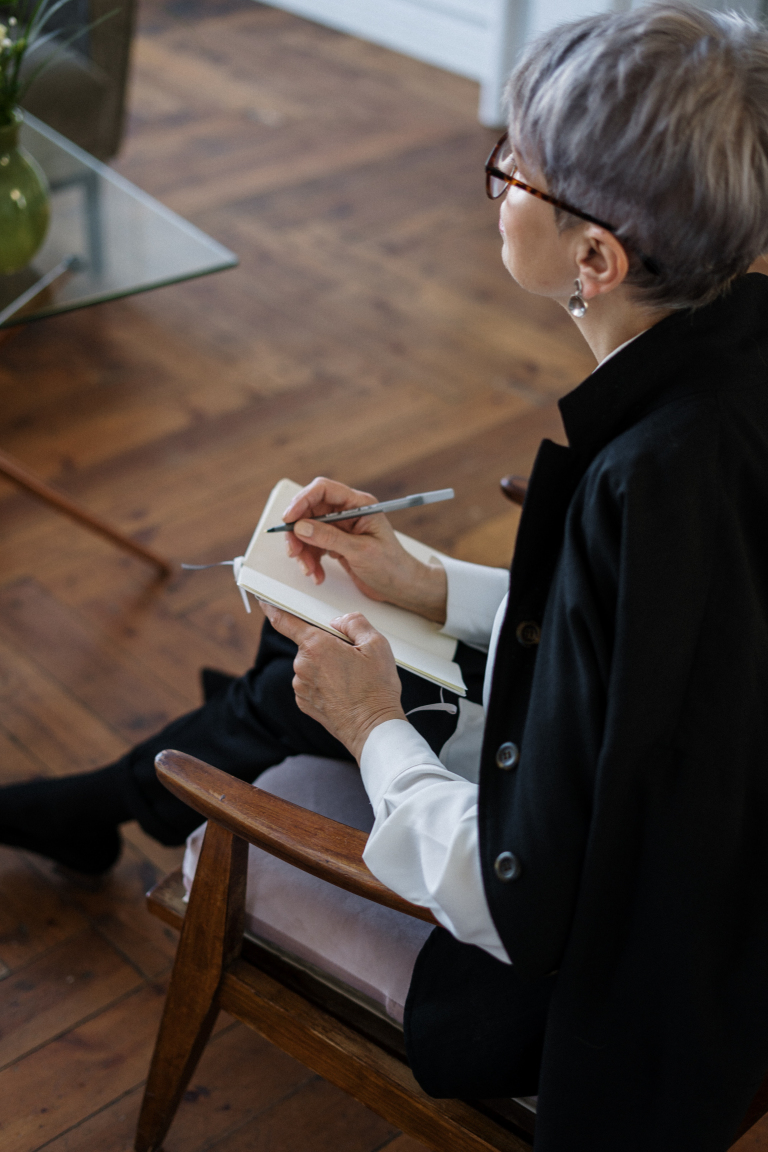 Man in an online psychotherapy session talking with his therapist by video