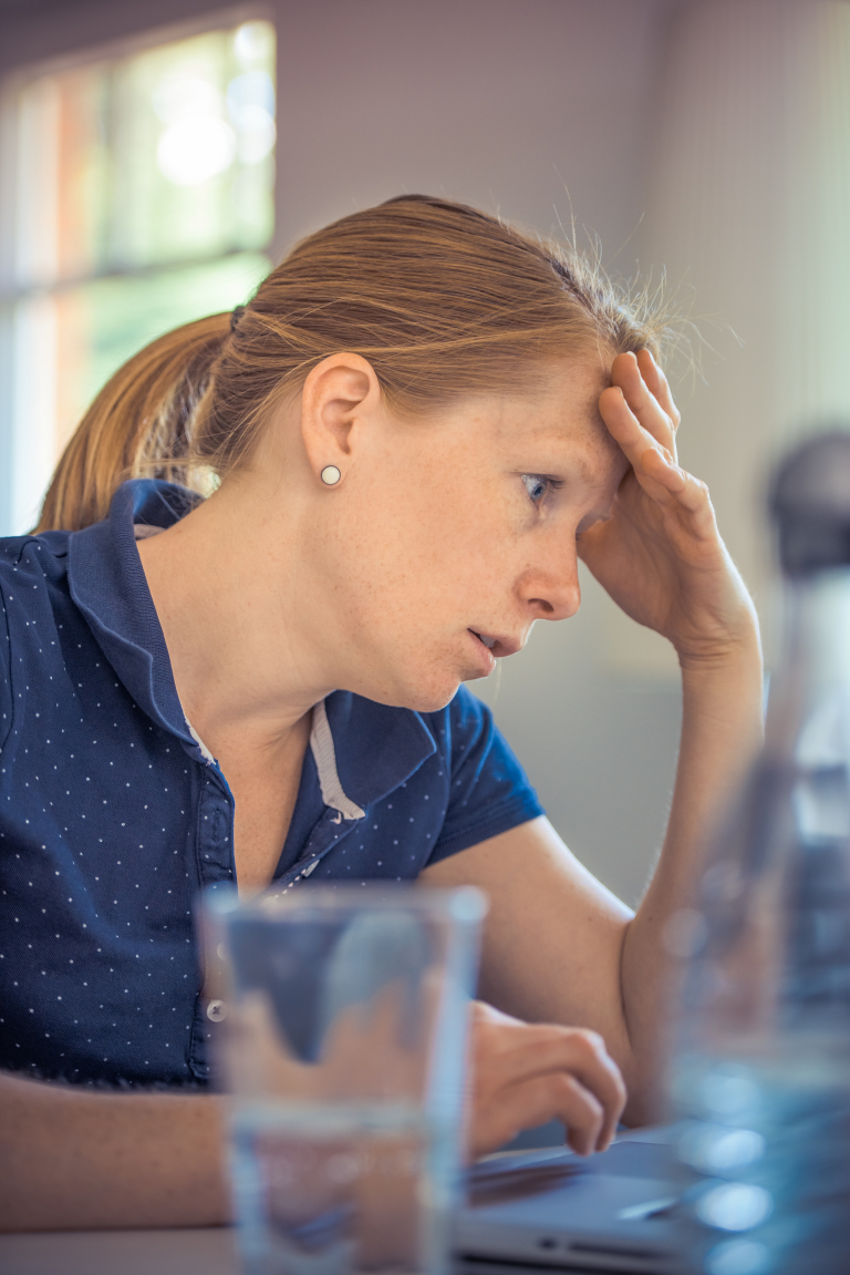 Young woman sitting quietly at home before an online eating disorder counselling session