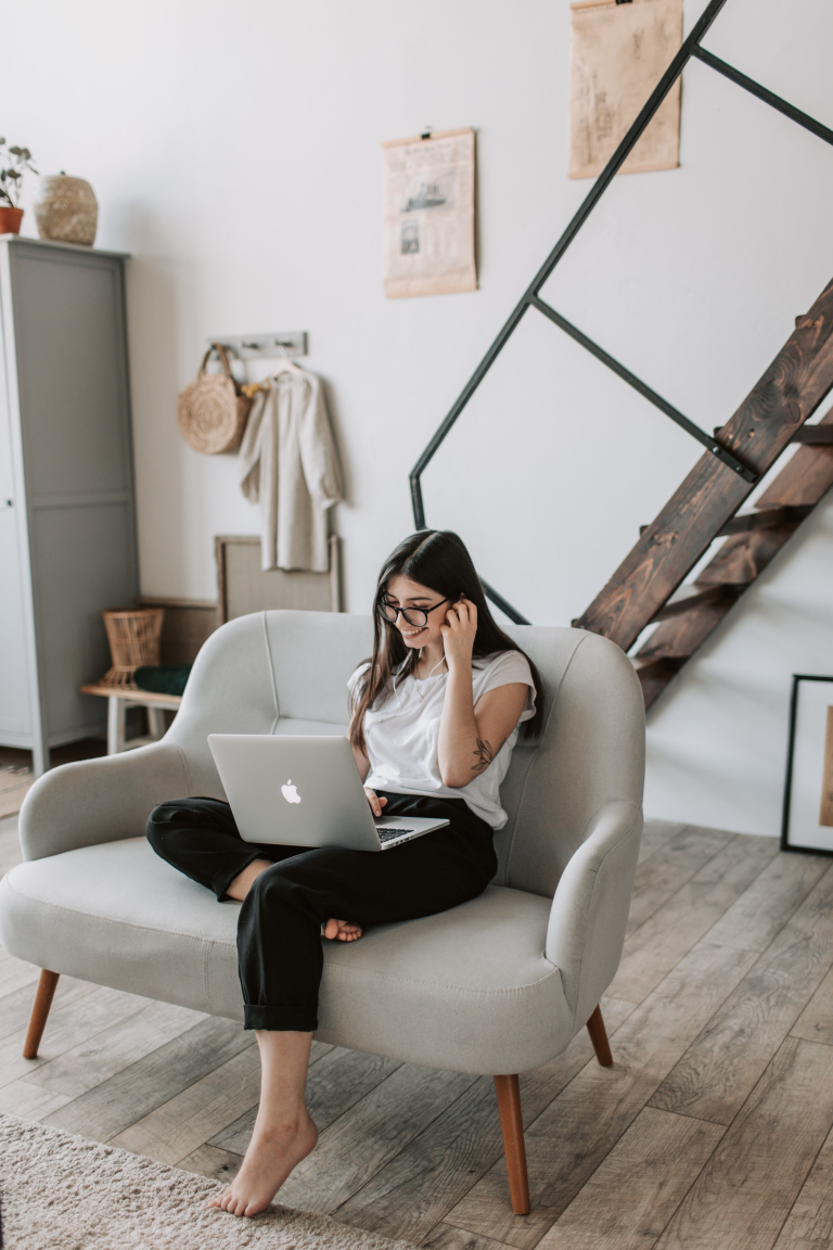 Woman relaxing at home before an online humanistic therapy session