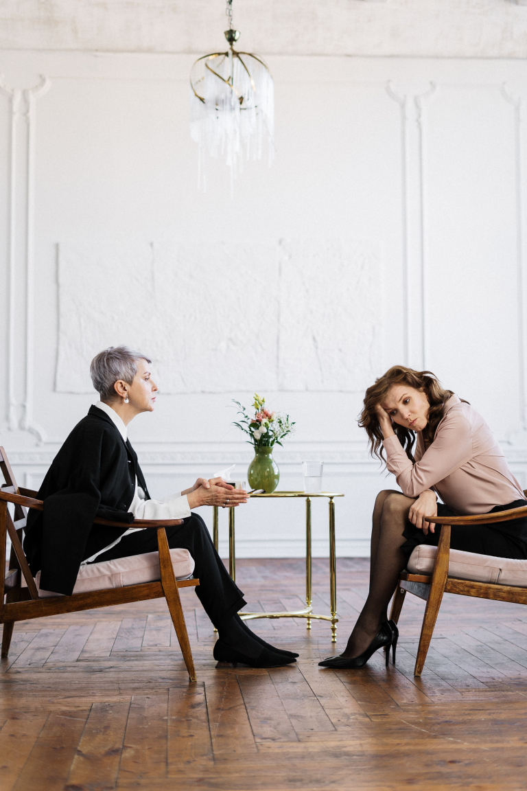 Woman reflecting quietly at home before an online psychoanalytic therapy session