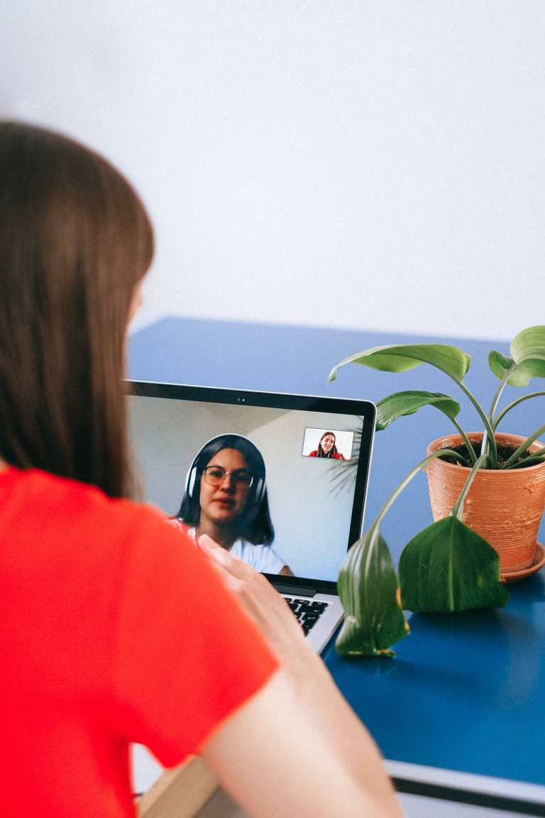 Man speaking openly with his humanistic therapist over a video call